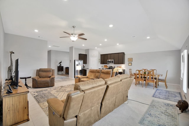 living room with ceiling fan and light tile patterned floors