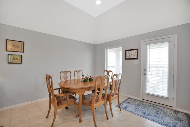 dining room with light tile patterned floors and a healthy amount of sunlight