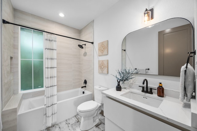 full bathroom featuring shower / tub combo with curtain, vanity, and toilet