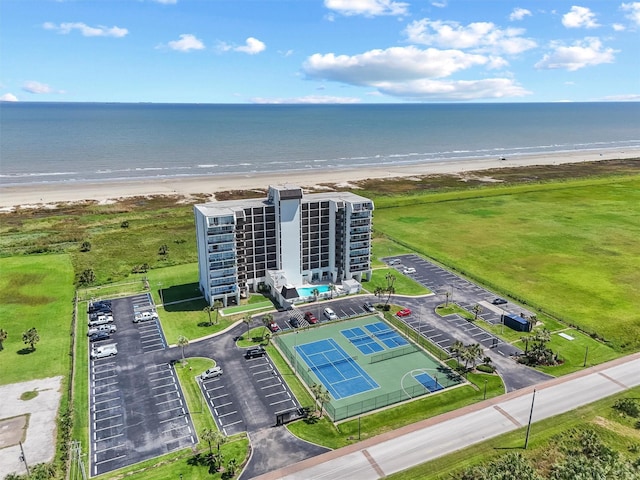 bird's eye view featuring a water view and a view of the beach