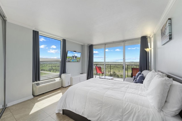 tiled bedroom with access to outside, a wall unit AC, a wall of windows, and ornamental molding