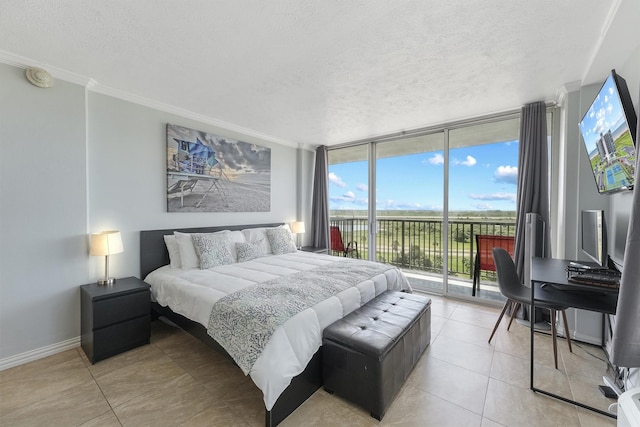 tiled bedroom with a textured ceiling, access to outside, and floor to ceiling windows