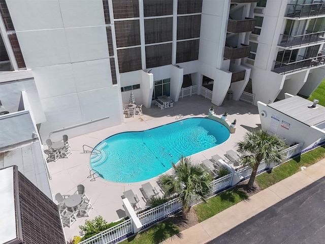 view of swimming pool with a patio area