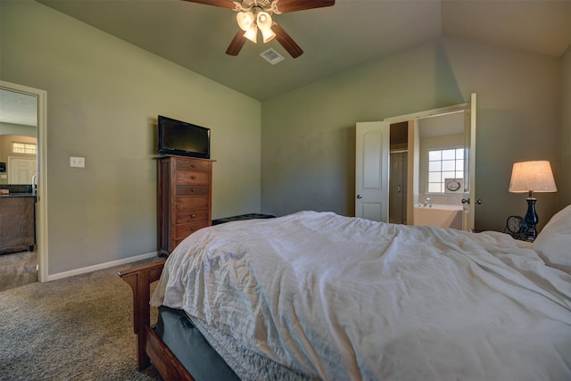 carpeted bedroom with ceiling fan, lofted ceiling, and connected bathroom