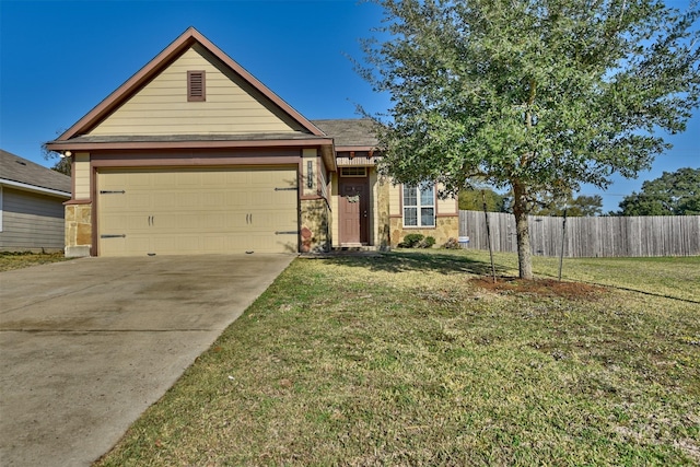 view of front of house featuring a garage and a front lawn