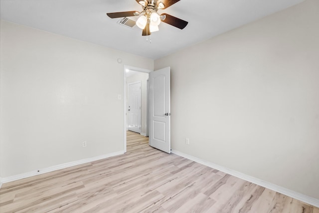 unfurnished room featuring ceiling fan and light wood-type flooring