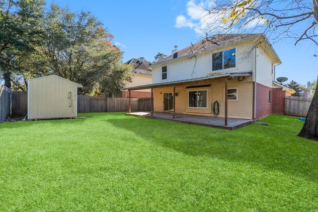 rear view of property with a lawn, a patio, and a storage shed