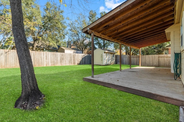 view of yard with a storage unit and a deck