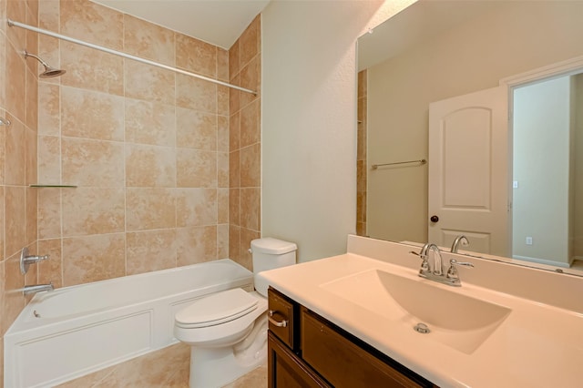 full bathroom with tile patterned flooring, vanity, tiled shower / bath combo, and toilet