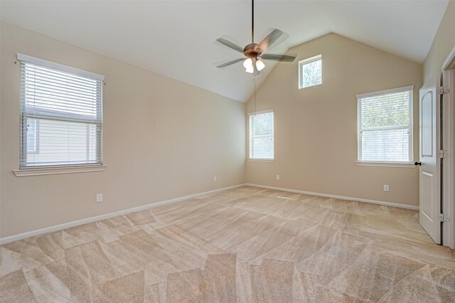 unfurnished room featuring ceiling fan, high vaulted ceiling, and light carpet