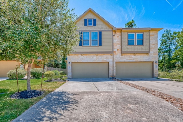 view of front of house with a front lawn and a garage