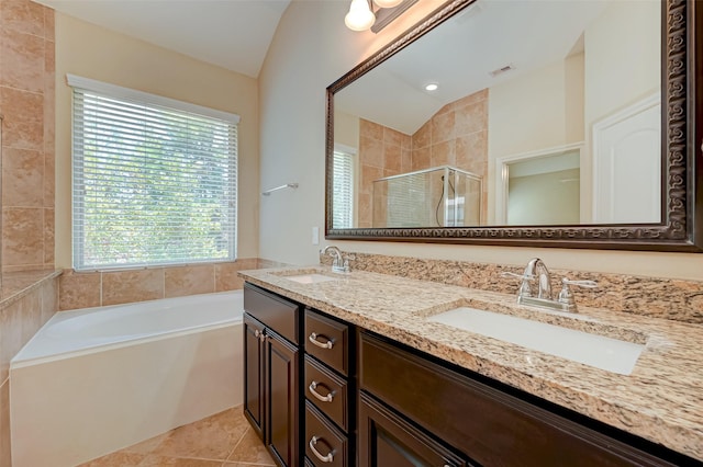 bathroom featuring tile patterned floors, vanity, lofted ceiling, and shower with separate bathtub