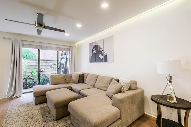 living room with hardwood / wood-style floors and ceiling fan