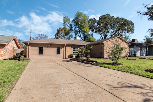 ranch-style home with a front lawn