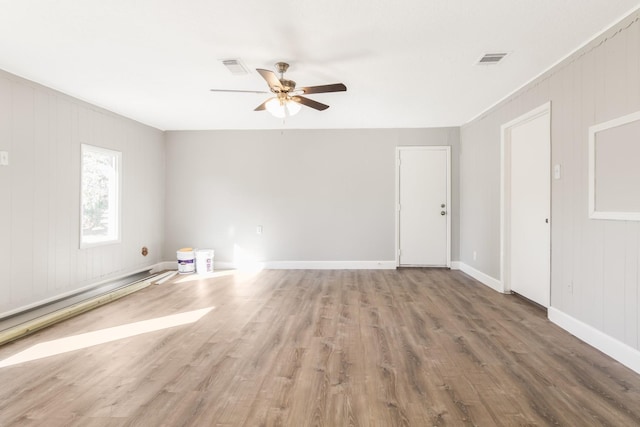 spare room with wood-type flooring and ceiling fan