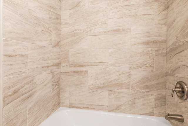 bathroom featuring a tub to relax in