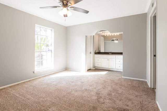 unfurnished bedroom featuring ceiling fan and light colored carpet