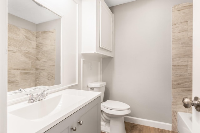 bathroom featuring hardwood / wood-style floors, vanity, and toilet