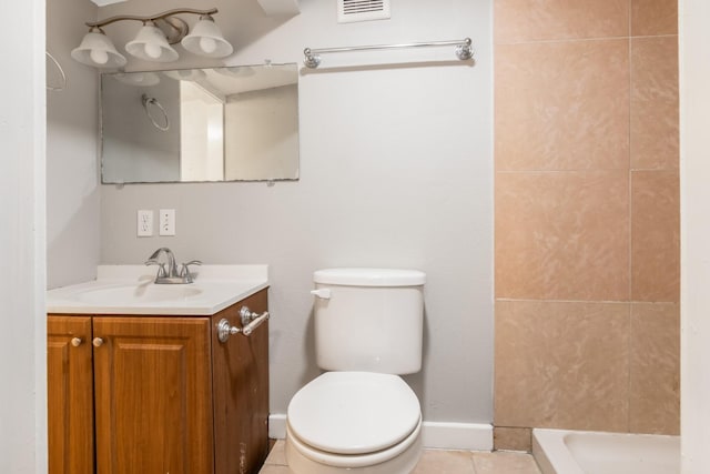 bathroom with tile patterned flooring, vanity, toilet, and a shower