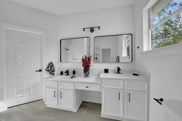 bathroom with tile patterned flooring and vanity