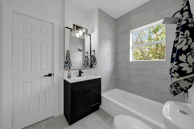 full bathroom featuring vanity, toilet, and tiled shower / bath