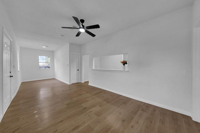 spare room with ceiling fan and wood-type flooring