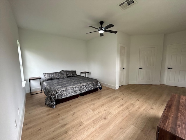 bedroom with light wood-type flooring and ceiling fan