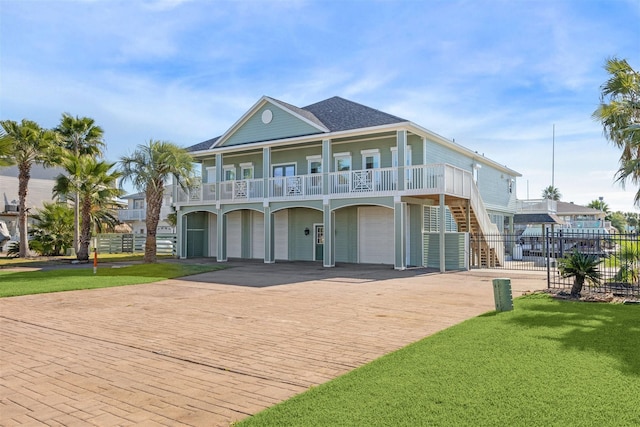 view of front facade featuring a garage and a front lawn