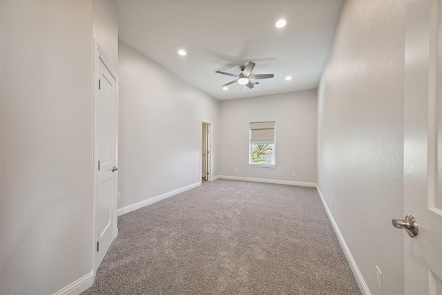 carpeted empty room with ceiling fan