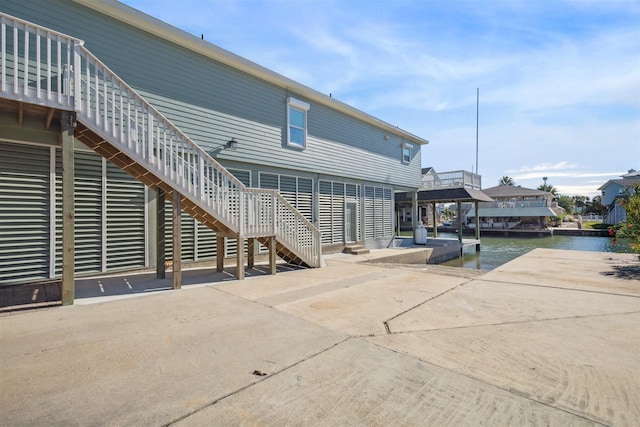 back of house with a water view