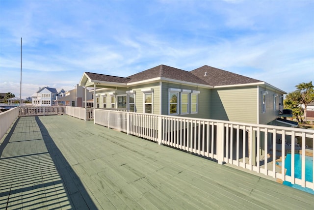 back of property featuring a swimming pool side deck