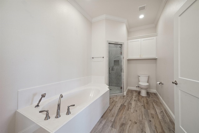 bathroom with toilet, ornamental molding, shower with separate bathtub, and hardwood / wood-style flooring