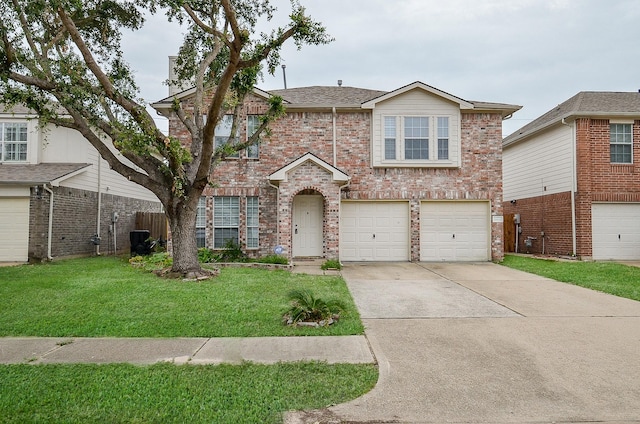 view of front of home featuring a garage and a front yard