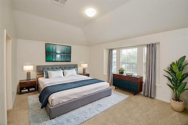 carpeted bedroom with vaulted ceiling