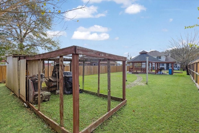 view of yard featuring an outbuilding and a gazebo