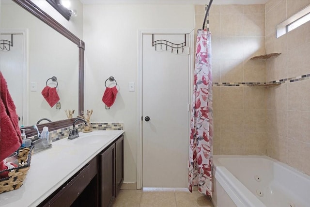 bathroom featuring tile patterned flooring, vanity, and shower / bath combo with shower curtain