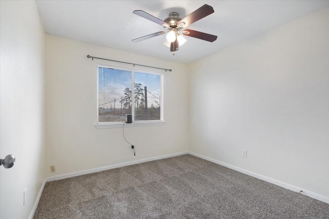 empty room featuring carpet flooring and ceiling fan