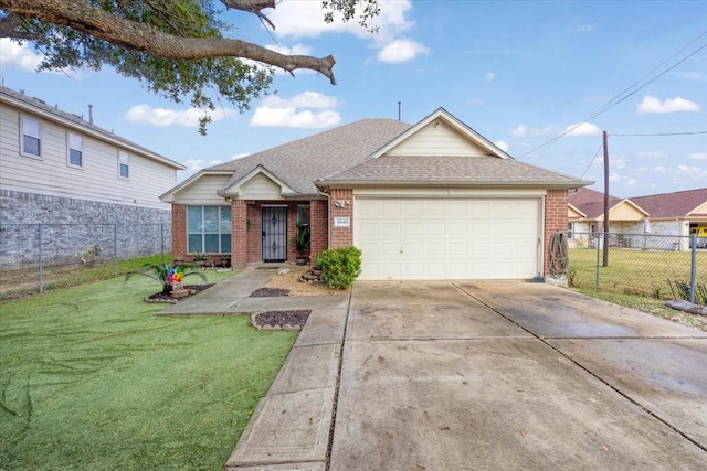 view of front of home with a garage and a front lawn