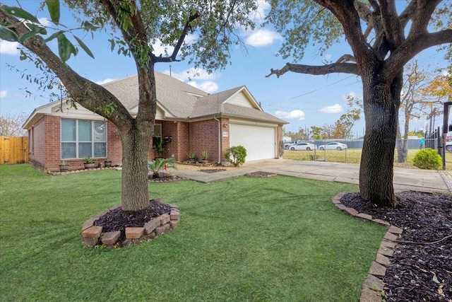 view of front of property featuring a garage and a front yard