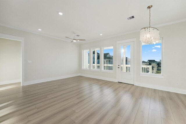 unfurnished living room with ceiling fan with notable chandelier, ornamental molding, and light hardwood / wood-style flooring