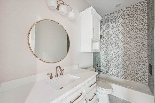 full bathroom with tiled shower / bath combo, toilet, and vanity