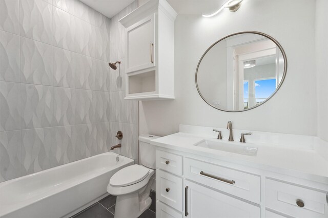 full bathroom featuring tile patterned floors, vanity,  shower combination, and toilet