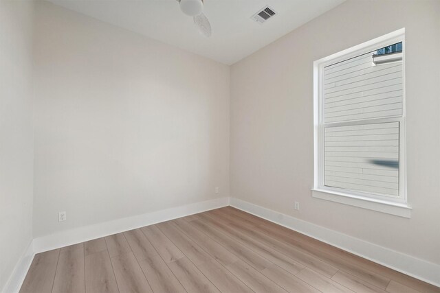 empty room featuring light hardwood / wood-style flooring and ceiling fan