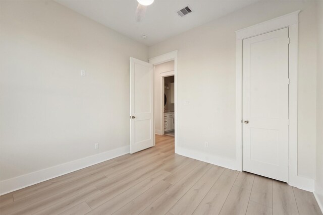 unfurnished bedroom featuring light hardwood / wood-style flooring and ceiling fan