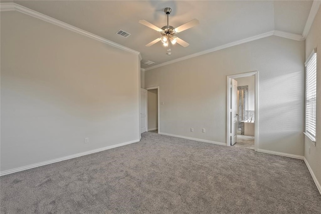 unfurnished bedroom featuring crown molding, ensuite bath, vaulted ceiling, ceiling fan, and carpet floors