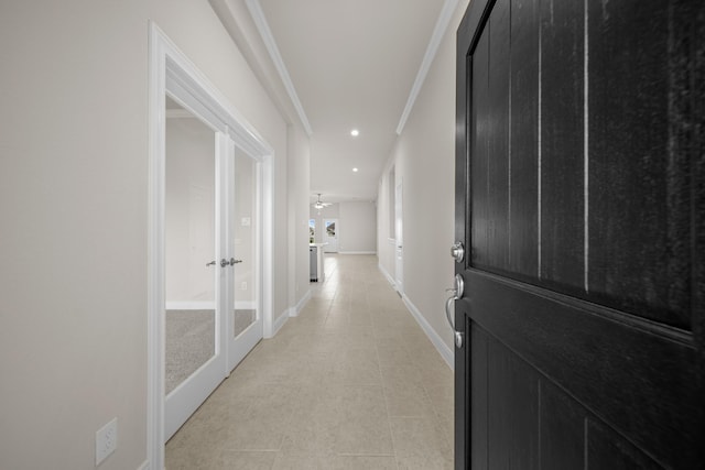 hallway with baseboards, ornamental molding, and recessed lighting