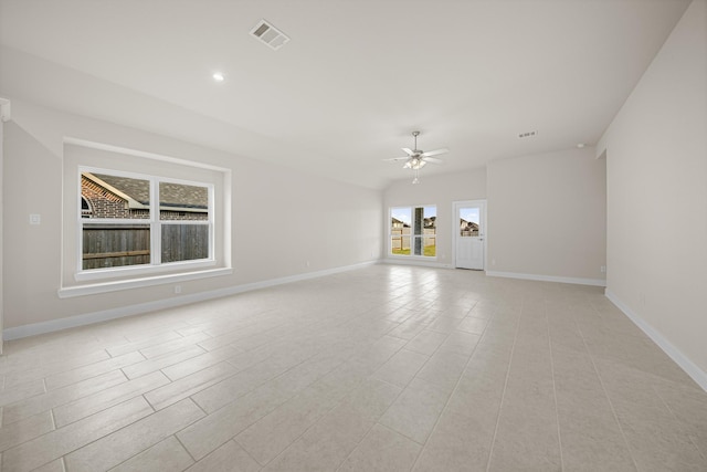 unfurnished living room with ceiling fan, visible vents, baseboards, and recessed lighting