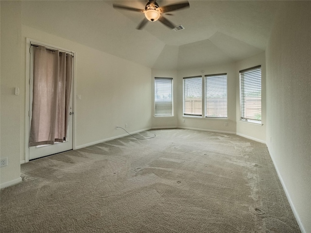 carpeted empty room with ceiling fan and vaulted ceiling