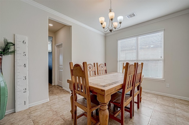 tiled dining room featuring a chandelier, plenty of natural light, and ornamental molding