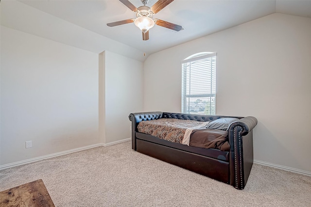 bedroom with ceiling fan, light colored carpet, and lofted ceiling